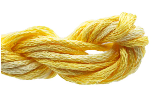 Yellow embroidery floss on a white background