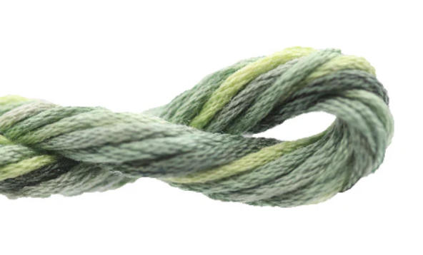 Green skein of yarn on a white background
