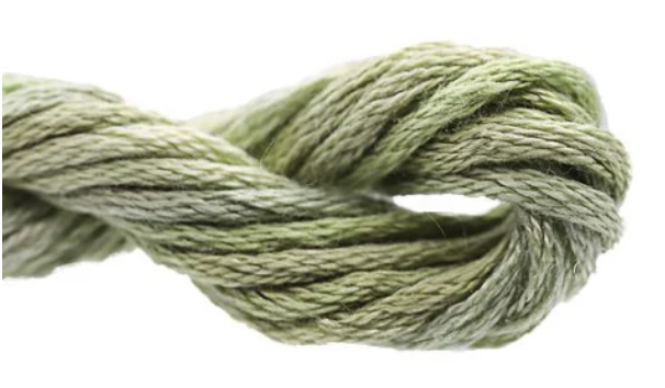 Close-up of green rope tied in a knot on a white background