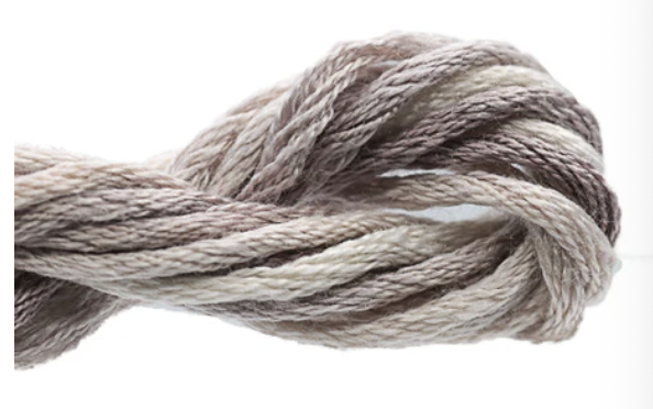 Close-up of a skein of gray yarn on a white background