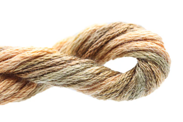 Close-up of a skein of brown yarn on a white background