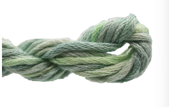 Green skein of yarn on a white background