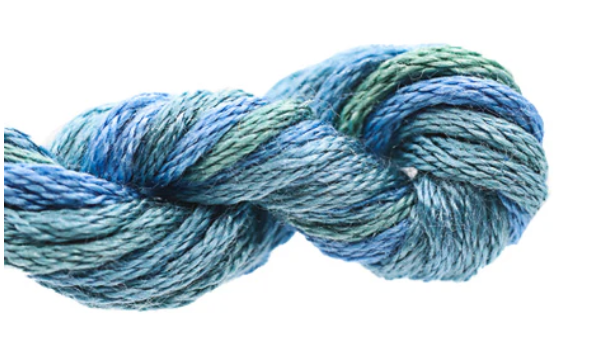 Blue and green skein of yarn on a white background