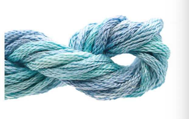 Blue skein of yarn on a white background