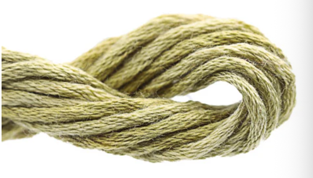 Coiled green rope on a white background