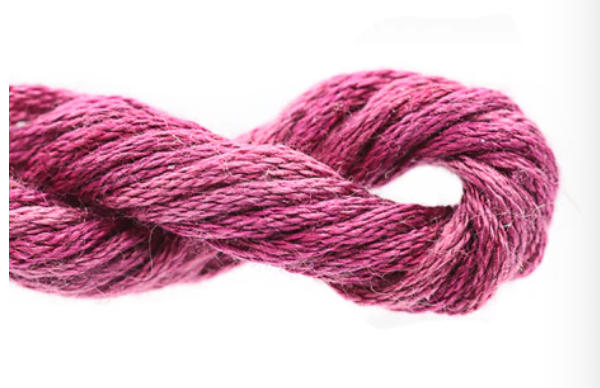 Close-up of pink yarn on a white background