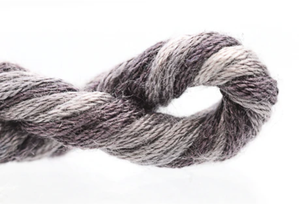 Gray skein of yarn on a white background