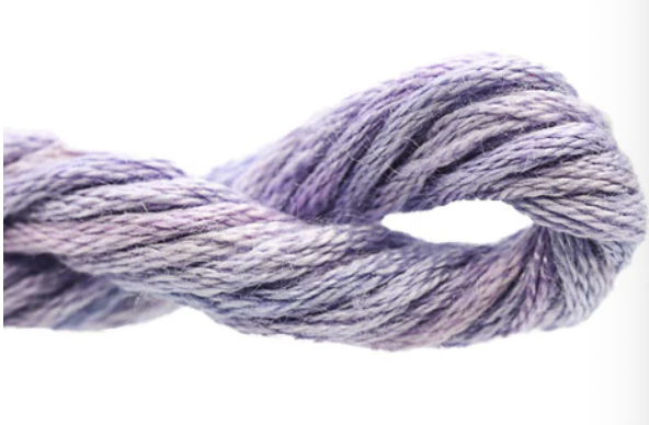 Close-up of purple and white yarn on a white background