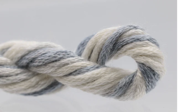 Multicolored yarn skein on a light gray background