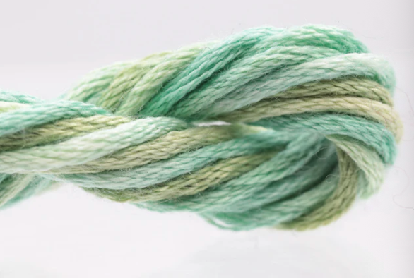 Multicolored yarn skein on a white background