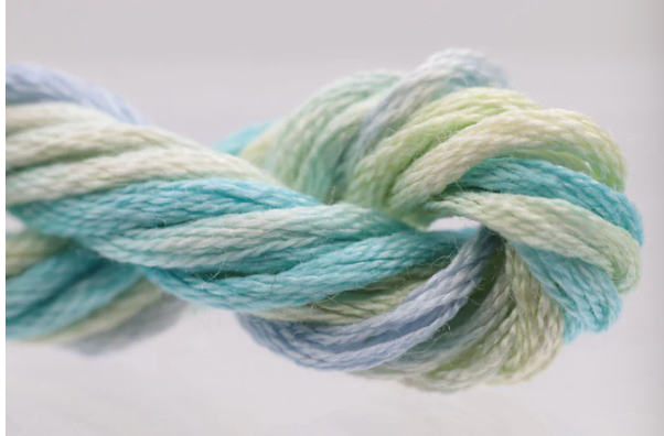 Multicolored yarn skein on a white background