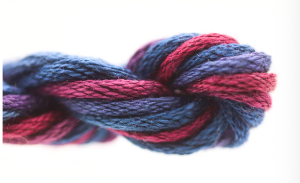 Braided yarn with red and blue colors on a white background