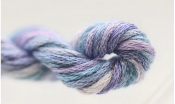 Multicolored skein of yarn on a light background