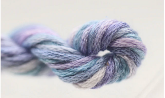 Multicolored skein of yarn on a light background