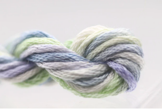 Multicolored yarn skein on a light gray background
