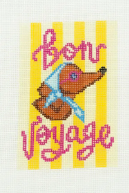 Cross-stitched design with a bird and 'Bon Voyage' text on a striped background