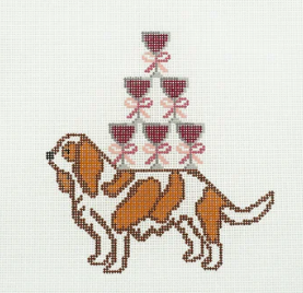 Cross-stitched design of a dog with wine glasses and a bow tie on a white background