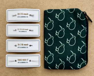 Green pouch with white patterns and labels on a brown background
