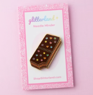 Chocolate bar with a pink decorative card featuring 'glitterlicious' branding.
