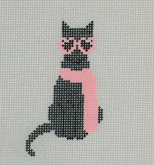 Cross-stitched pattern of a black cat with pink scarf on gray fabric