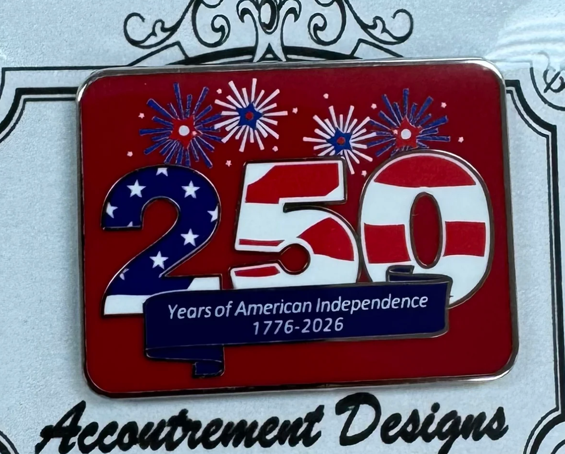Pin with '250 Years of American Independence 1776-2026' design on a red background with fireworks.