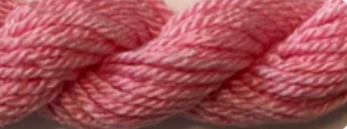 A close-up of a pink and white variegated twisted yarn or thread.