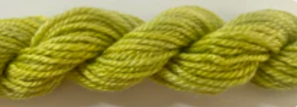 A close-up of a twisted skein of yarn in a light olive green color.