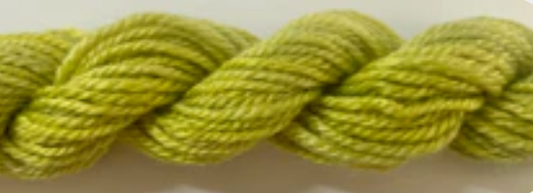 A close-up of a twisted skein of yarn in a light olive green color.