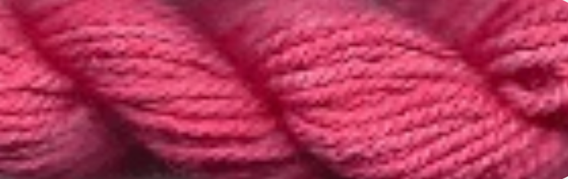 A close-up of twisted yarn in a medium pink color, showing the texture of the fiber.