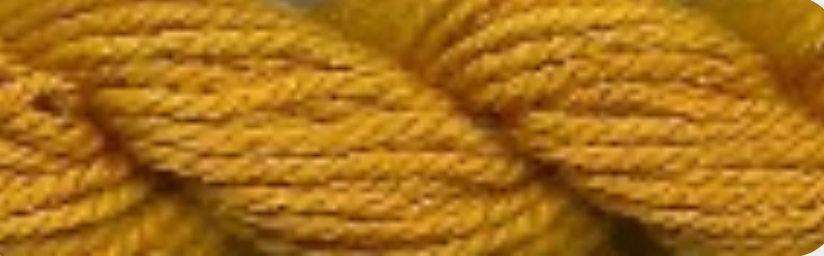 A close-up of twisted yarn or cord in a warm mustard yellow color.