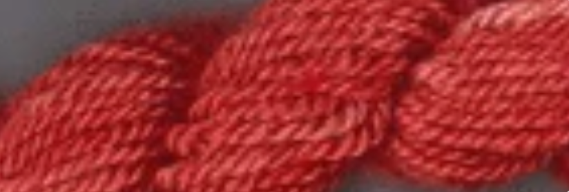 A close-up of a red twisted yarn or cord texture