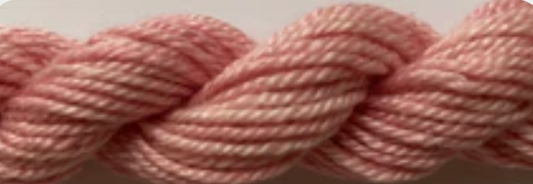 Twisted yarn skein in a soft dusty pink color