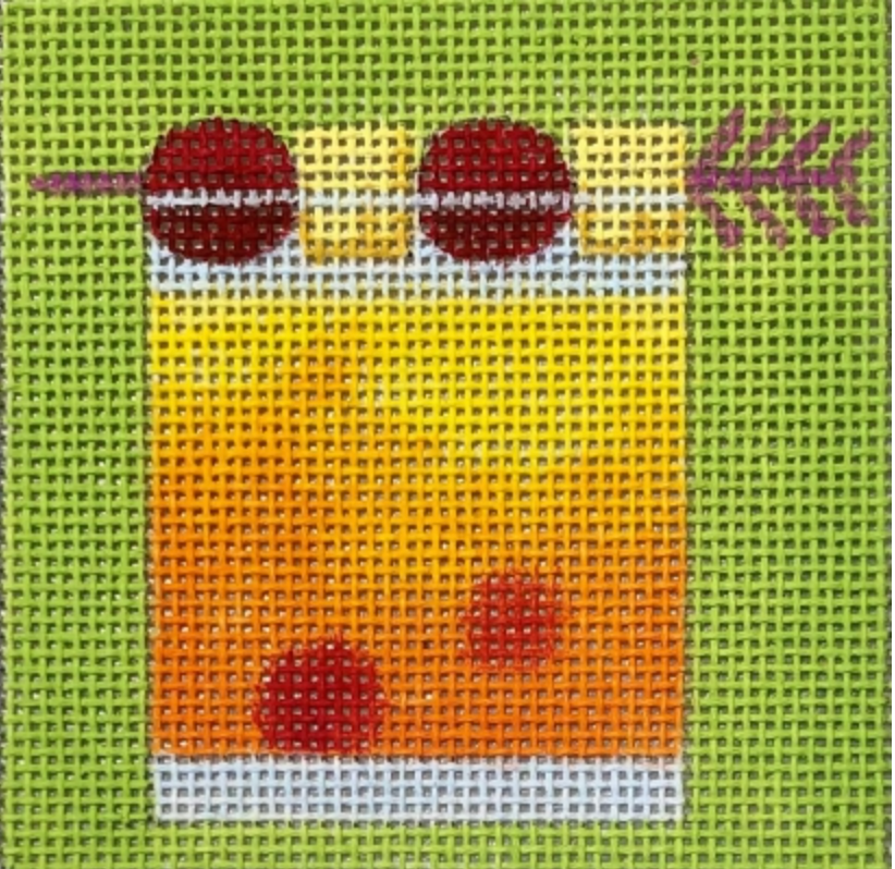 Cocktail glass needlepoint design with orange drink and red cherries