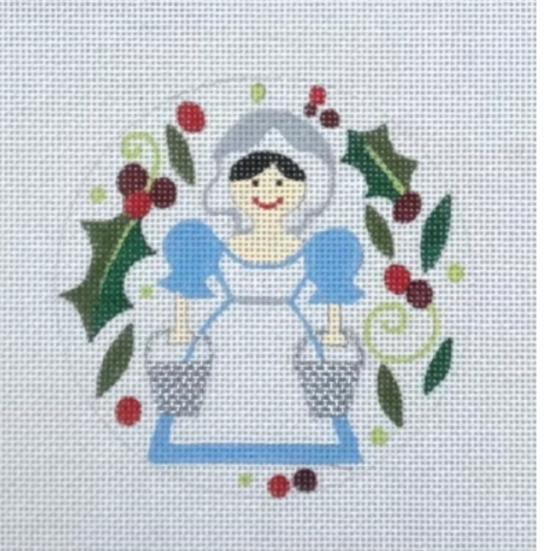 Snow White in blue and white dress with holly and berries