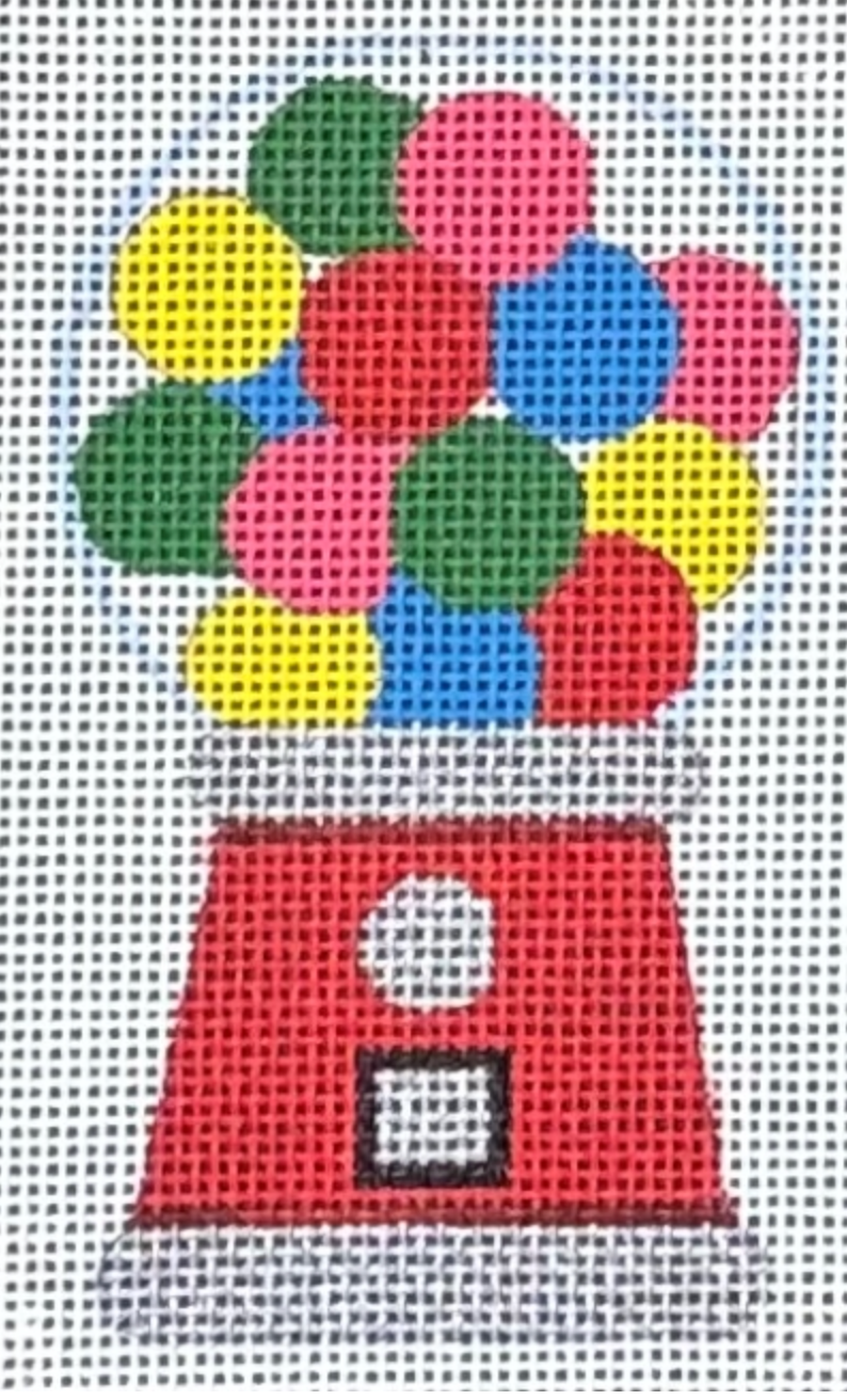 Colorful gumball machine with red base and multicolored gumballs