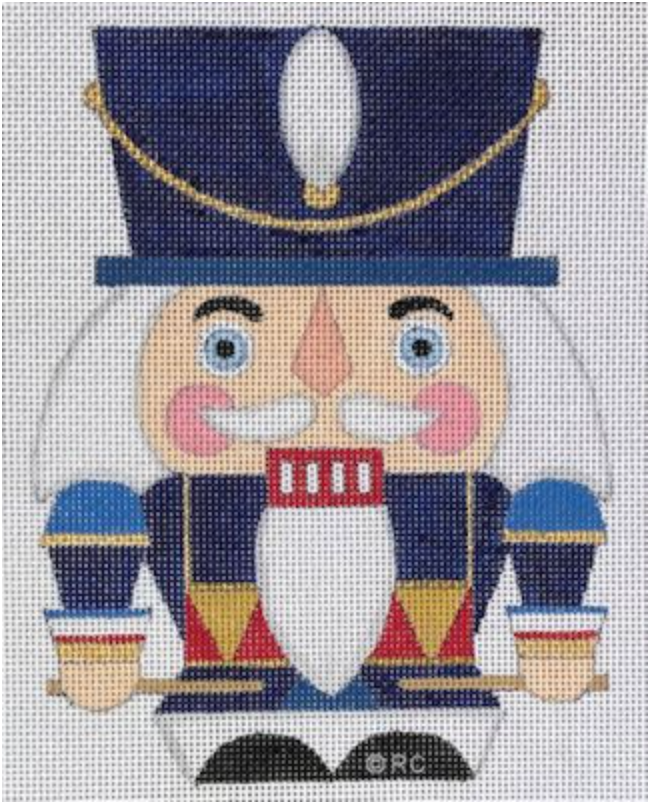 Cartoon nutcracker with blue hat, white beard, and red coat