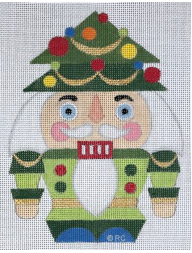 Festive nutcracker with Christmas tree hat, ornaments, and green coat