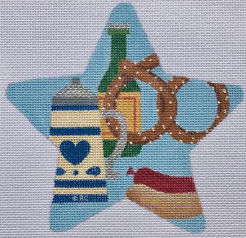 Beer-themed star-shaped needlepoint design with a mug and pretzel