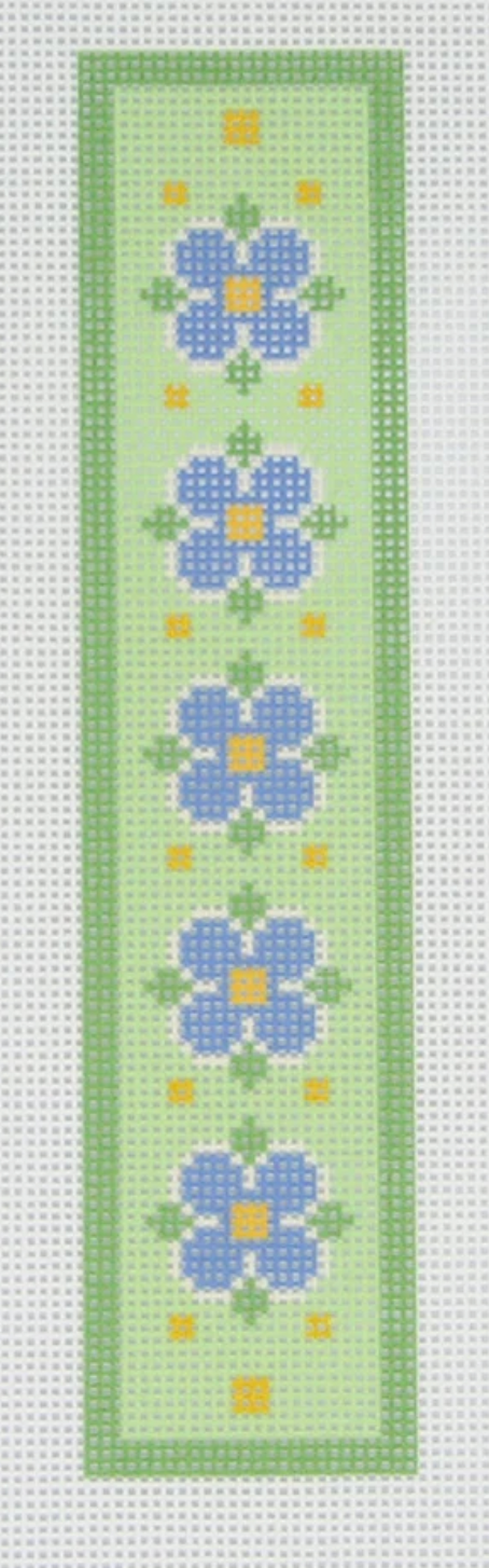 Green needlepoint design with blue and yellow flowers