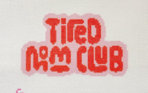 Pixelated red text reading “Tired Mom Club” on a light background
