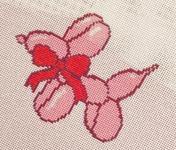 Pink balloon dog with red bow
