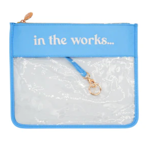 Blue pouch with clear front and 'in the works...' text on a white background