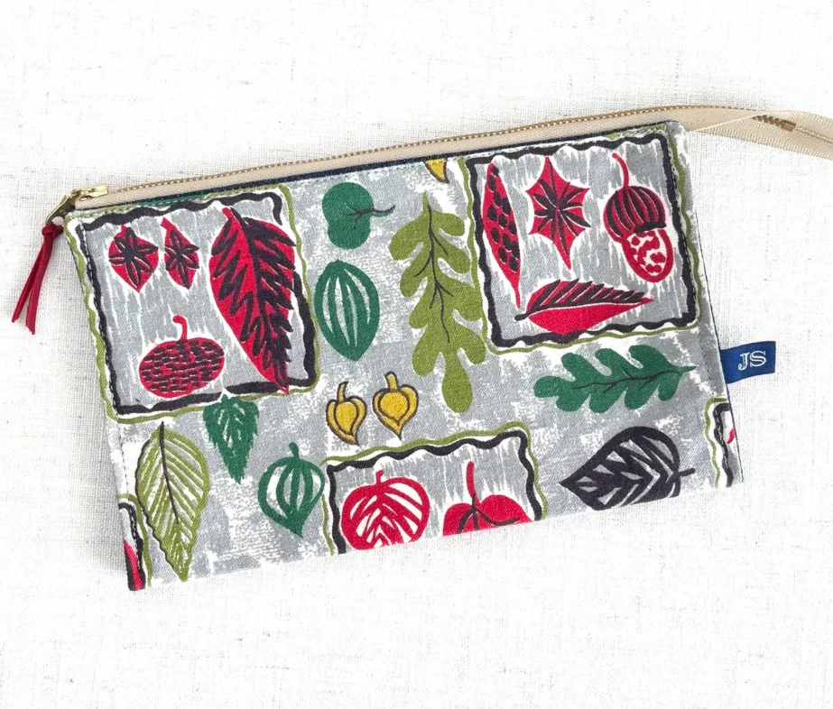 Fabric pouch with leaf pattern on a white background