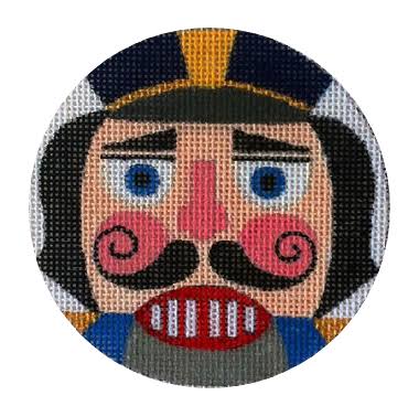 A circular needlepoint canvas featuring a stylized nutcracker face