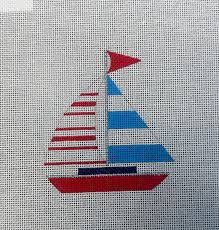 Sailboat with red and striped sails on a needlepoint canva