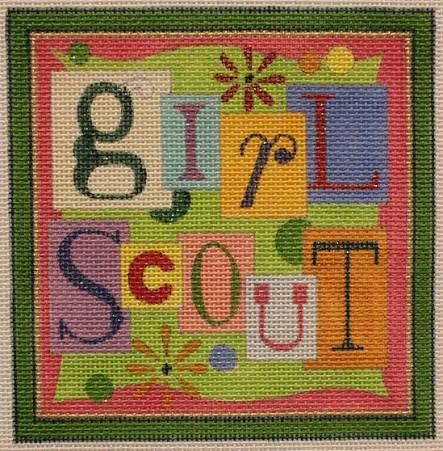 A square needlepoint canvas featuring colorful “GIRL SCOUT” letters