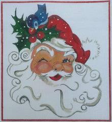 Decorative needlepoint of Santa Claus's face with a blue bird and holly leaves.